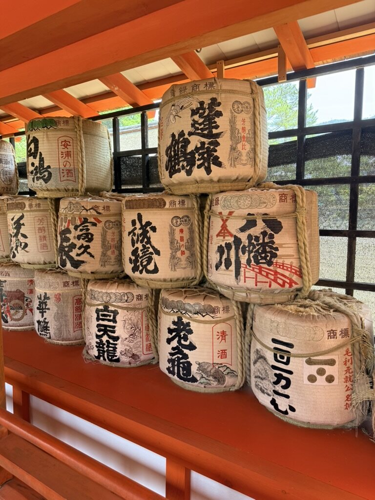 Painted sake barrels stacked at Itsukushima Shrine, Miyajima, Japan